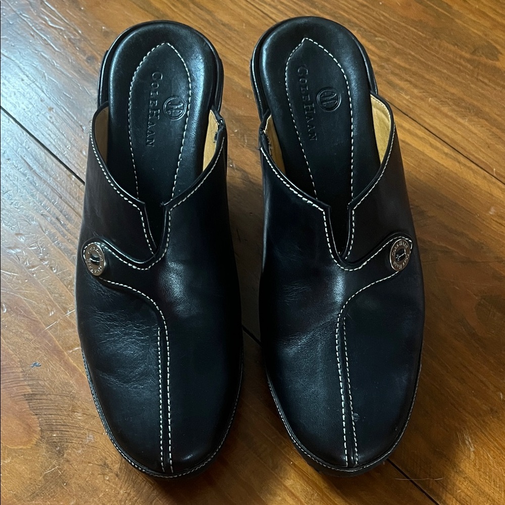 Cole Haan Black Leather Slip-On Mules with White Stitching and Logo Button